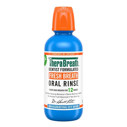 Blue bottle of TheraBreath Fresh Breath Oral Rinse in Invigorating Icy Mint on white background